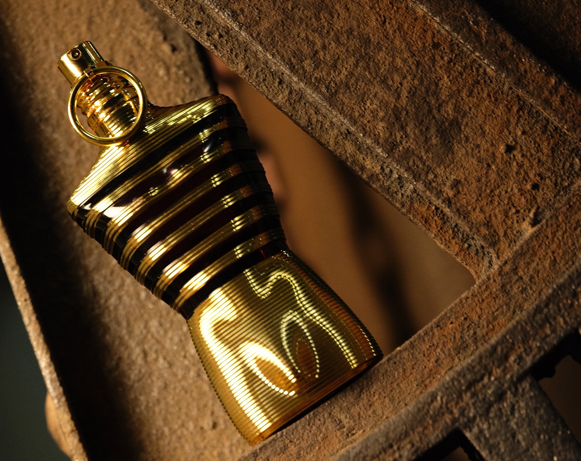 Gold lighter on a textured surface